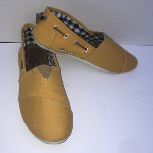 Yellow Toms styled flats